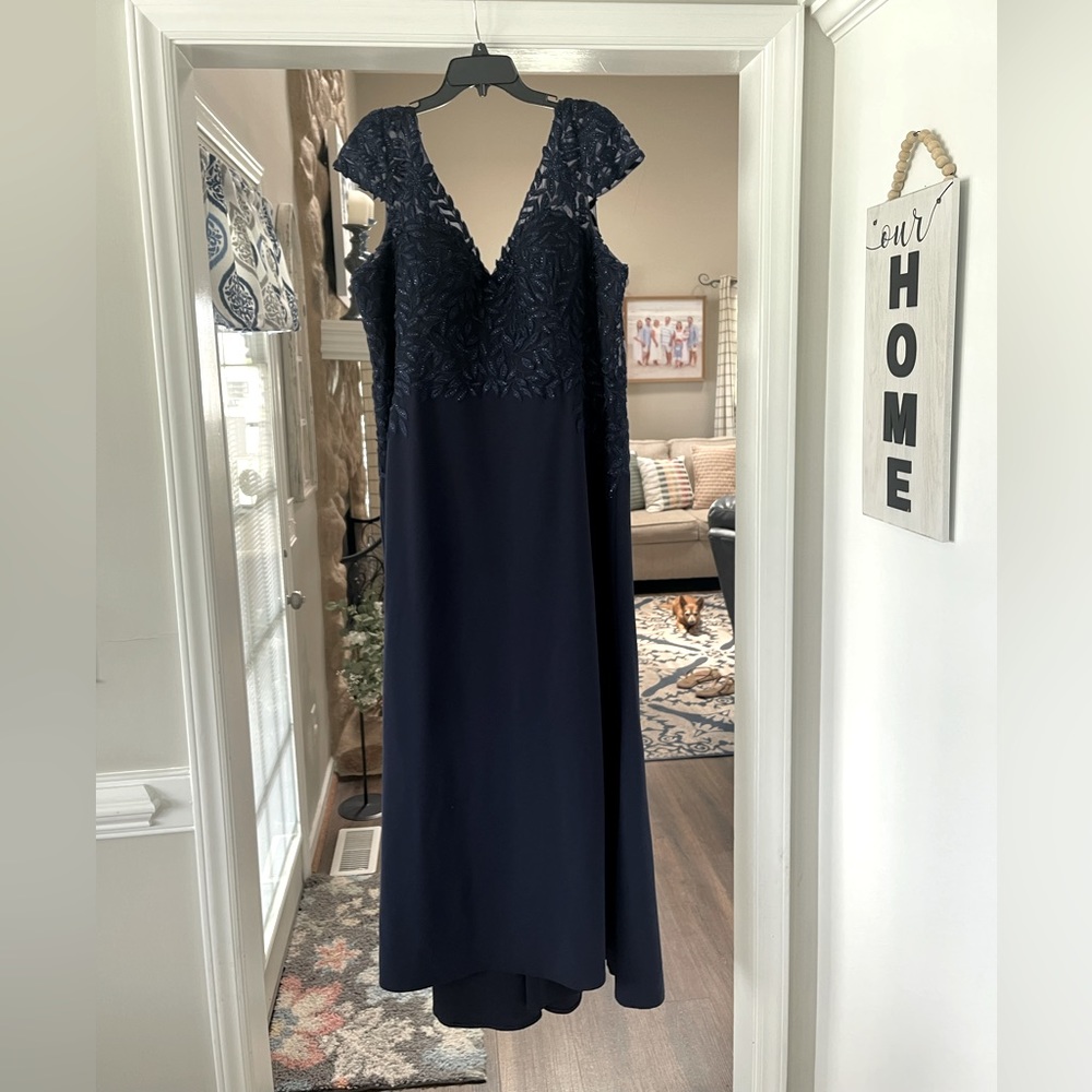 Mother of the Bride gown. Size 22 was altered to about a size 20. Navy blue.
